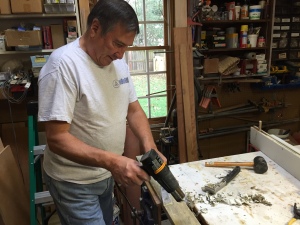 Mike, using the heat gun to remove the pain from areas requiring epoxy and major work.