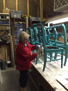 Pat buffs off the wax that she applied yesterday.