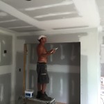 Mike cutting in at the ceiling in the guest bedroom.