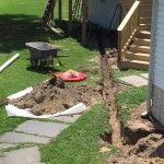 Trench fo main drain line to septic tank.