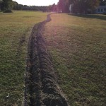 285 feet of 18" x 4" trench from garage to dock.
